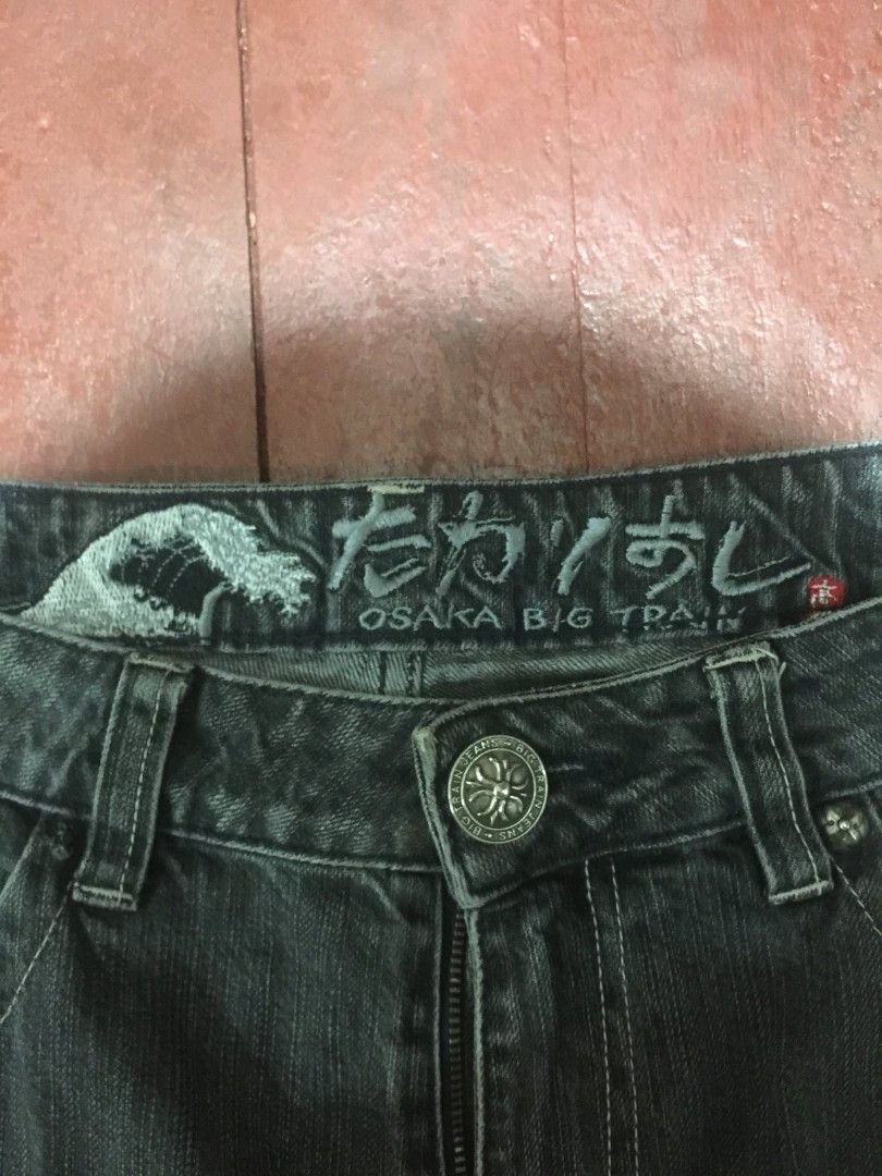 Y2K Osaka Big Train Denim Jeans (Category: Jeans) located in Manila. Submitted by carlosrexc26753 (Listing ID 1463921527, Image 3). Description: WAISTLINE: 34-35 LENGTH: 43.5 - Dark wash denim jeans - Straight leg fit - Unique textured detail on back right pocket - Button fly closure - Subtle distressing and fading throughout - Ideal for casual wear.