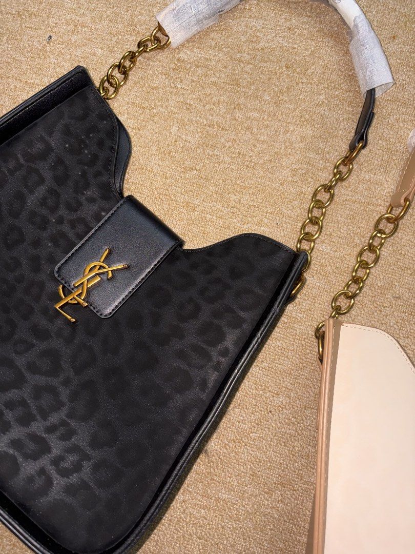 YSL Shoulder Bag (Category: Shoulder Bags) located in Minglanilla. Submitted by loramarie (Listing ID 1463801322, Image 1). Description: 🤍 Brand: Yves Saint Laurent (YSL) 👜 Style: Shoulder Bag 🎀 Color: Black & Beige ✨ Design: Classic quilted finish with YSL logo detail 🔗 Strap: Chain shoulder strap 🔒 Closure: Flap-style closure 🖤 Hardware: Gold-tone hardware 📏 Size: Medium / compact size 🎒 Interior: Spacious enough for daily essentials — 
