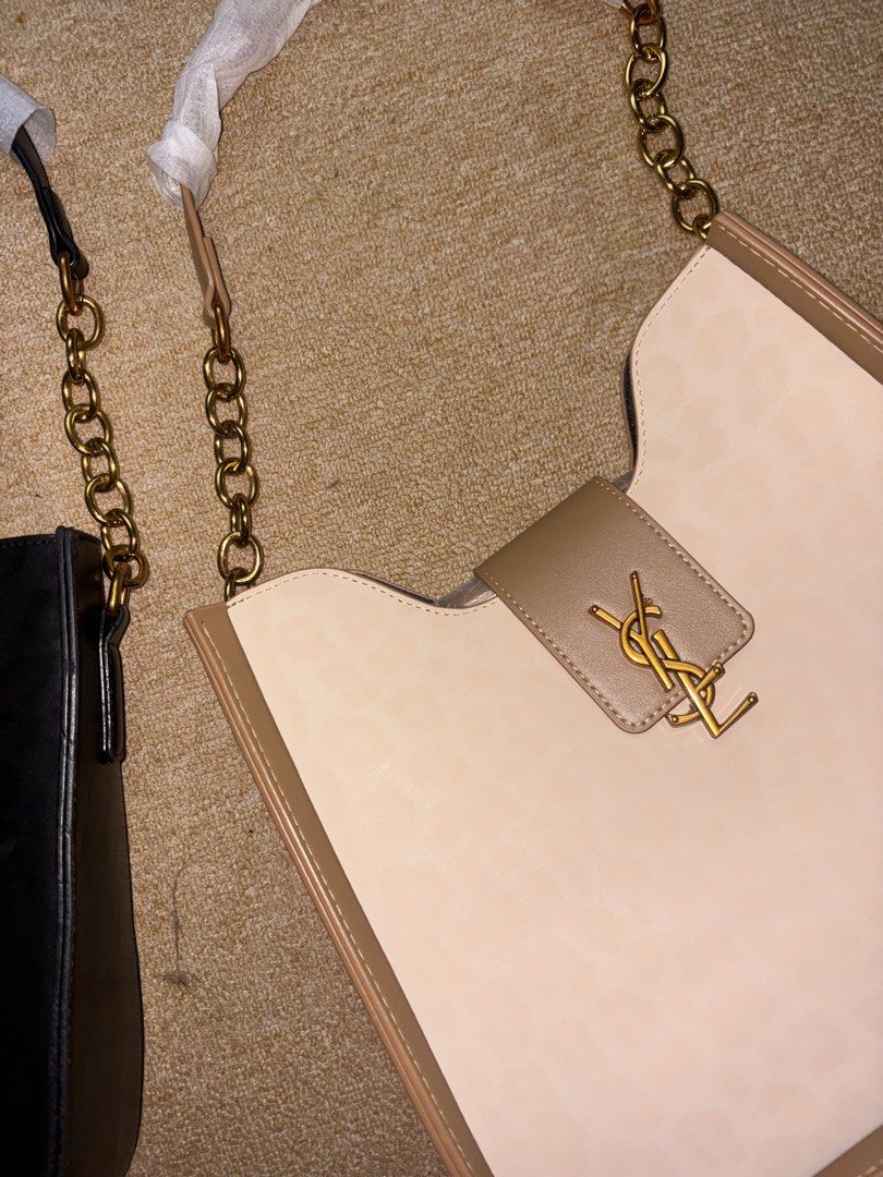 YSL Shoulder Bag (Category: Shoulder Bags) located in Minglanilla. Submitted by loramarie (Listing ID 1463801322, Image 2). Description: 🤍 Brand: Yves Saint Laurent (YSL) 👜 Style: Shoulder Bag 🎀 Color: Black & Beige ✨ Design: Classic quilted finish with YSL logo detail 🔗 Strap: Chain shoulder strap 🔒 Closure: Flap-style closure 🖤 Hardware: Gold-tone hardware 📏 Size: Medium / compact size 🎒 Interior: Spacious enough for daily essentials — 