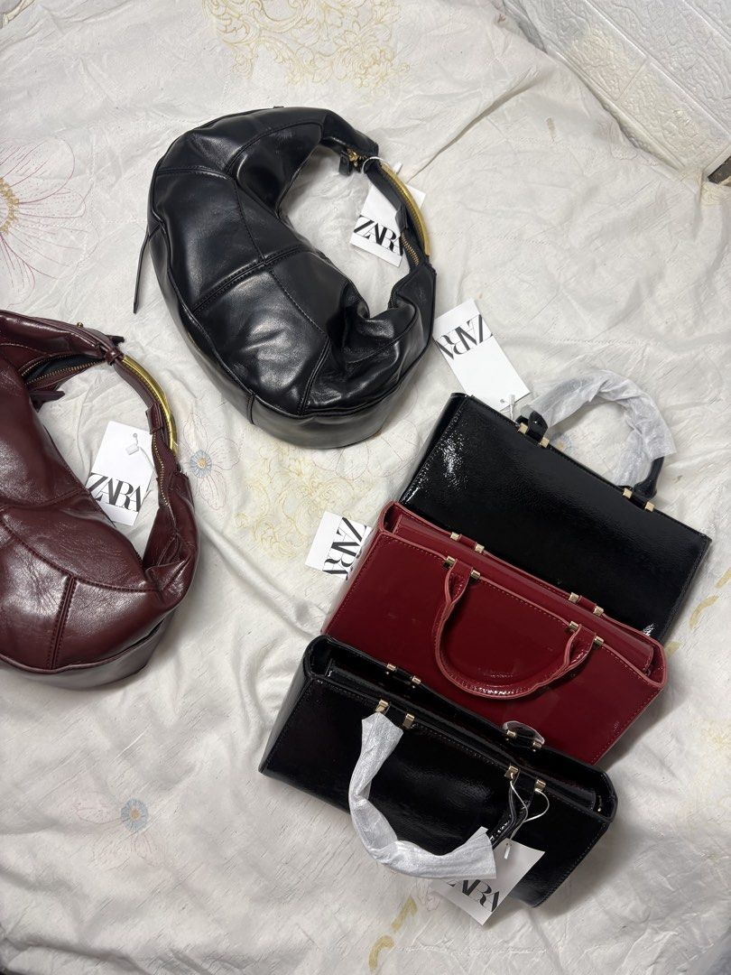Zara Bags (Category: Shoulder Bags) located in Minglanilla. Submitted by loramarie (Listing ID 1463789682, Image 1). Description: • Black & Burgundy — Shoulder / Underarm Bag • Black & Red — Structured Shoulder / Sling bag (With gold chain) • Brand new / unused • With original ZARA tags • Stylish, classy & easy to pair with any outfit PM for price & details 💌 📍 Cebu / shipping available.