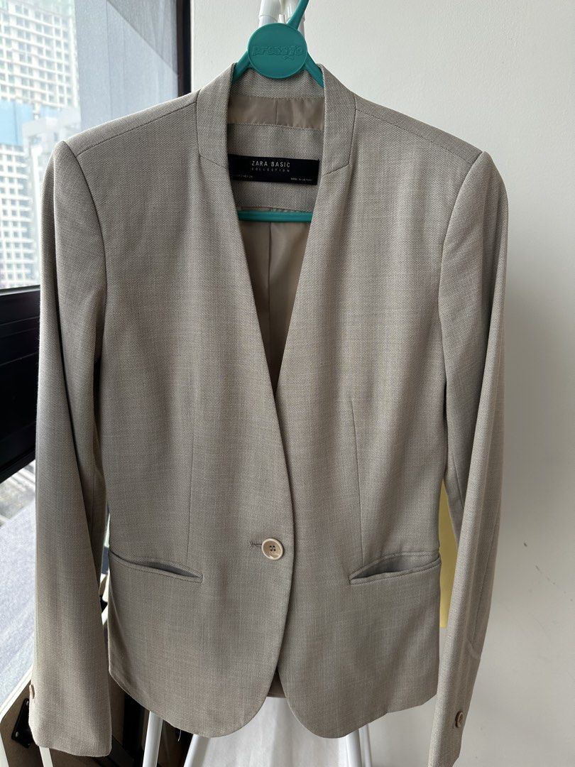 Zara Basic Collection Blazer (Category: Coats, Jackets and Outerwear) located in Kuala Lumpur. Submitted by power_home (Listing ID 1463795682, Image 1). Description: - Zara Basic light beige blazer - Collarless design - Single button closure - Two front pockets - Versatile for work or casual outfits.