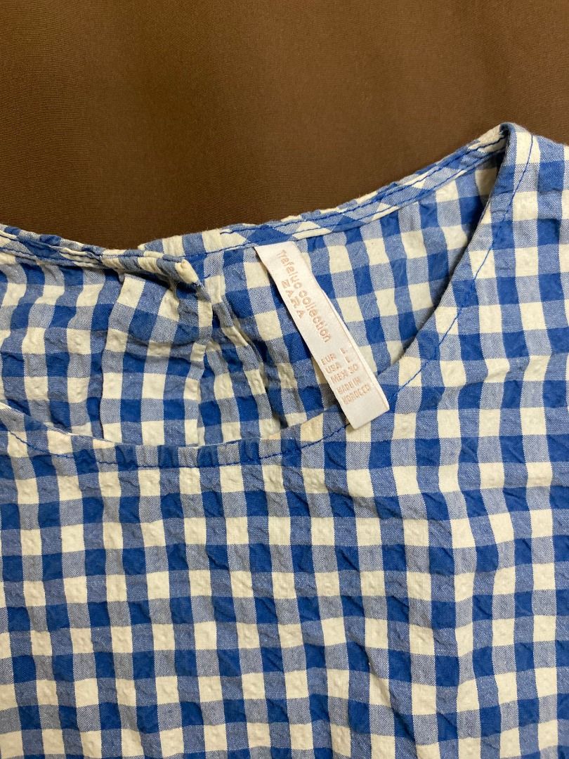 Zara Blue Gingham Peplum Top (Category: Sleeveless) located in San Pablo. Submitted by kisha_santonia (Listing ID 1463871289, Image 3). Description: - Cute Zara blue and white gingham top - Long sleeves - Peplum hem with ruffled elasticated waist - Textured fabric - Button closure at the back neck - Length: approx 20 inches.