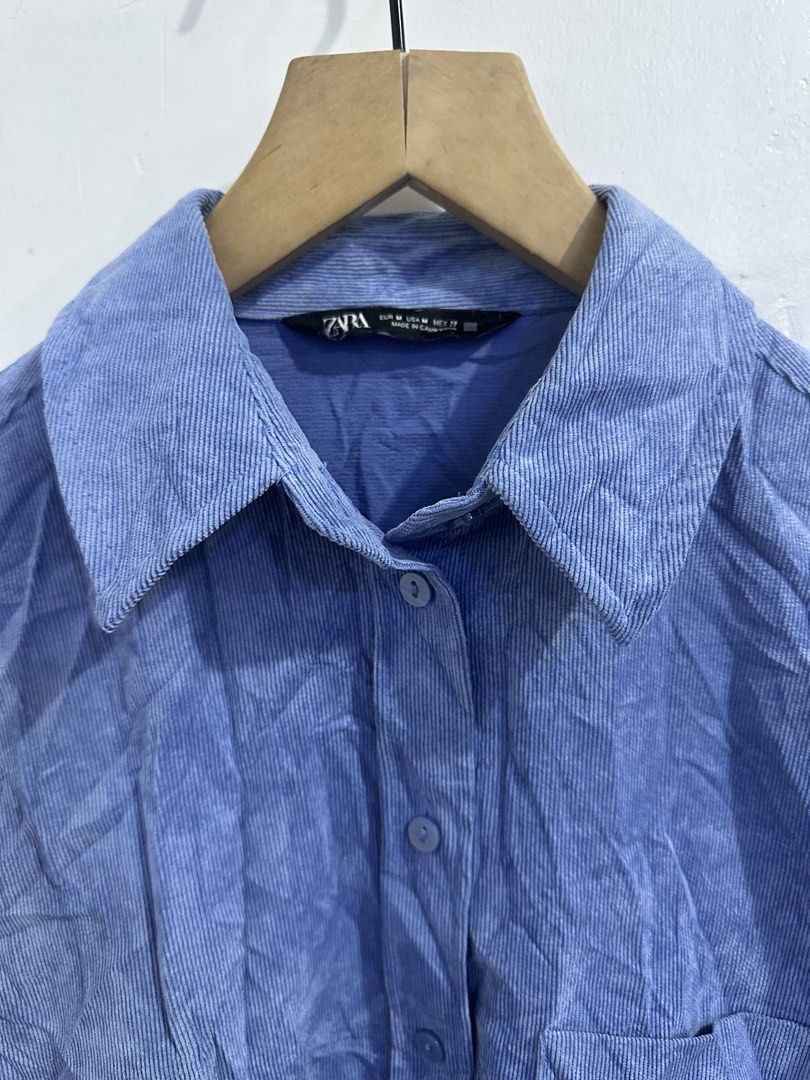 Zara Corduroy Button-Up Shirt (Category: Shirts) located in San Jose del Monte. Submitted by bizzybeebyhgc (Listing ID 1463829528, Image 2). Description: - Zara blue corduroy shirt - Long sleeves with button cuffs - Features a chest pocket - Nice fabric texture - Relaxed fit for comfortable wear - Perfect for casual outfits - Easy to style.