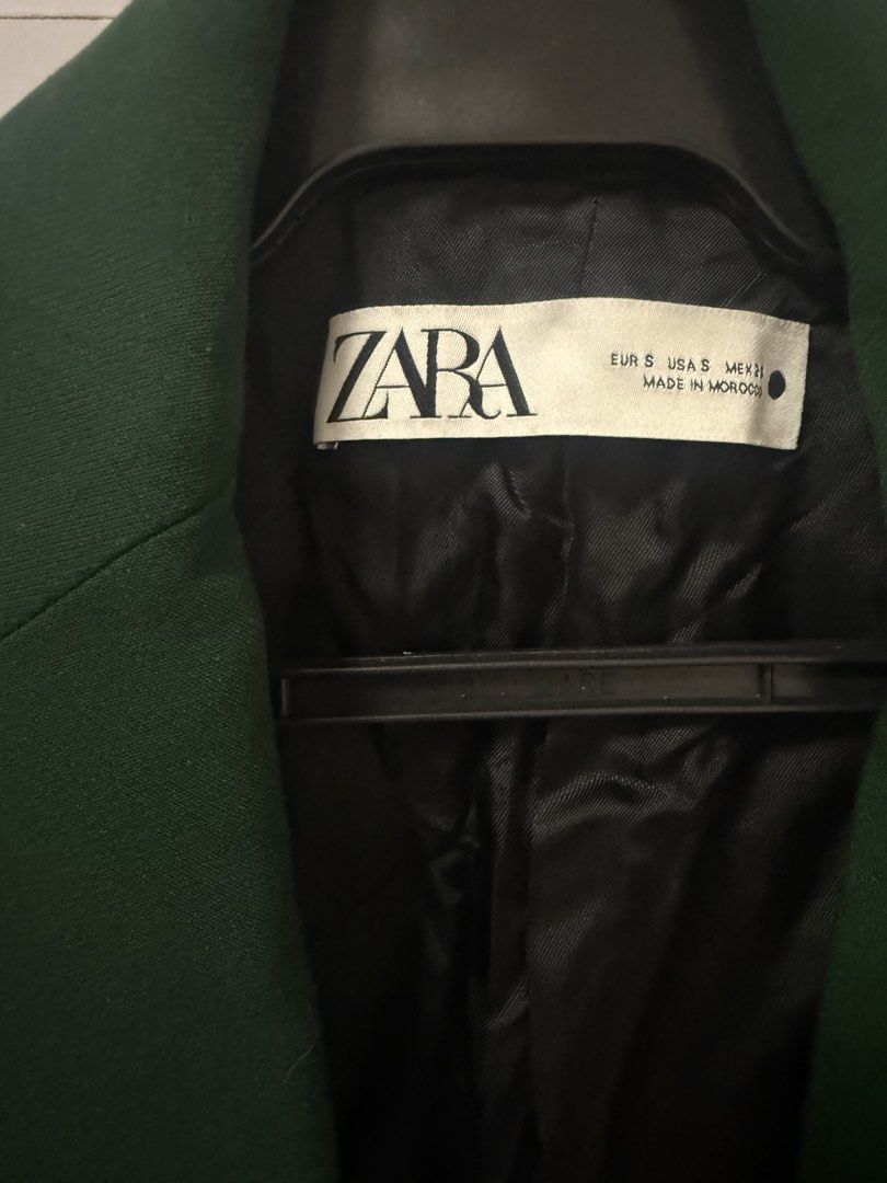 ZARA Green Single Button Blazer (Category: Coats, Jackets and Outerwear) located in Quezon City. Submitted by lovedbymaxandmikoy (Listing ID 1463844186, Image 2). Description: - Classic green blazer from ZARA - Single button closure - Two front pockets - Fully lined interior - Made in Morocco - Perfect for dressing up or down.