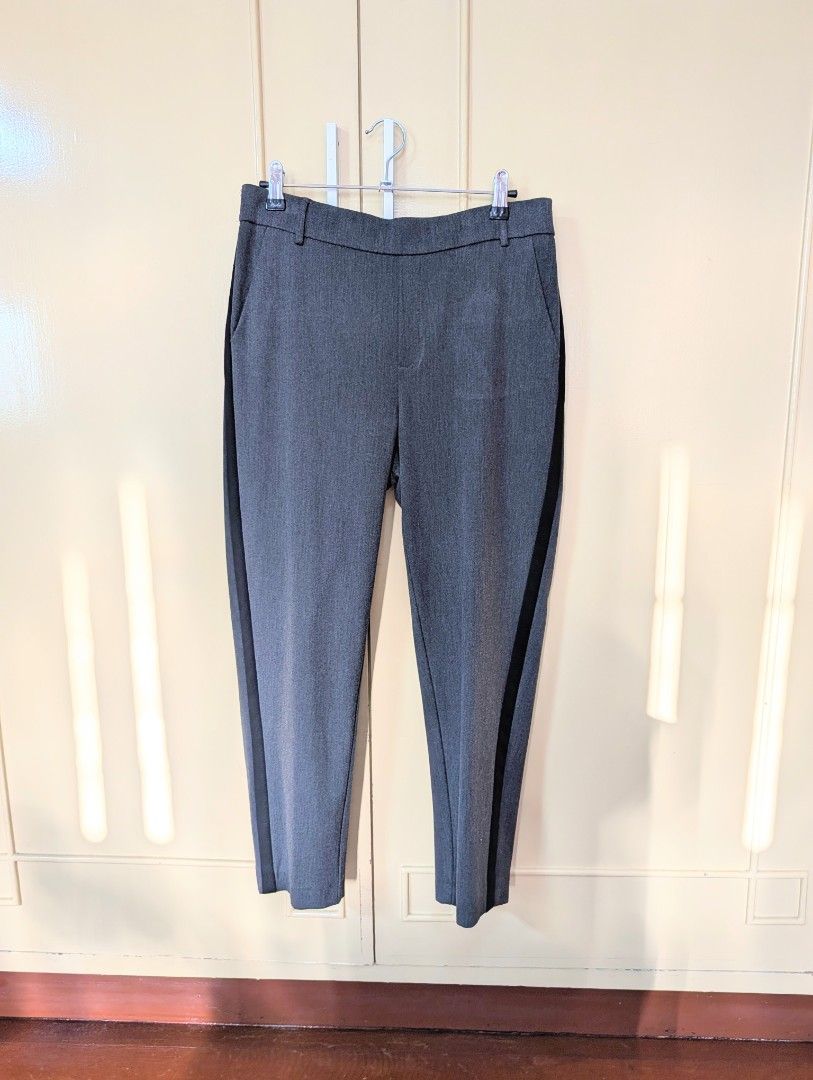 ZARA Trafaluc Collection Grey Trousers (Category: Other Bottoms) located in Santa Maria. Submitted by bax19 (Listing ID 1463935835, Image 1). Description: - Zara Trafaluc grey trousers - Cropped length - Elasticated waistband at the back for comfort - Side pockets - Black stripe detail down each leg - Perfect for casual or smart casual outfits.