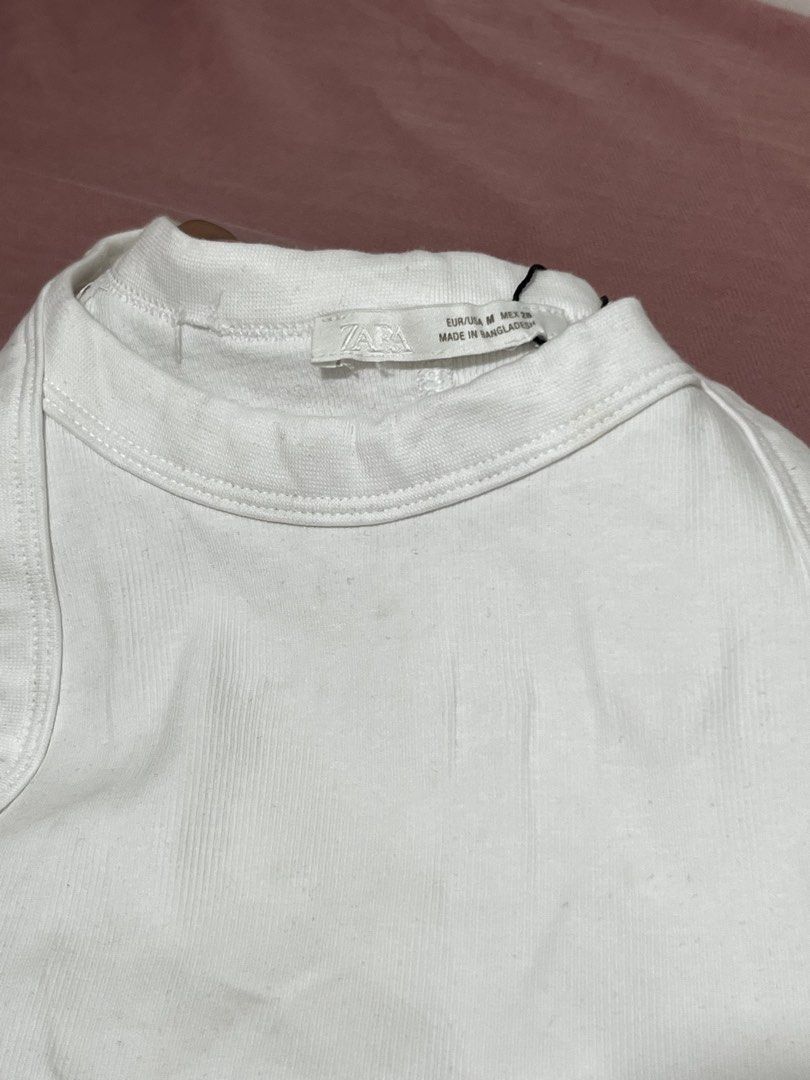 Zara White Ribbed Tank Top (Category: Sleeveless) located in Binan City. Submitted by lodeovn (Listing ID 1463823151, Image 3). Description: note: this is over 🏃 need wash 1 with mending - 69 1 without mending - sold size: small to med mop: gcash mod: jnt.