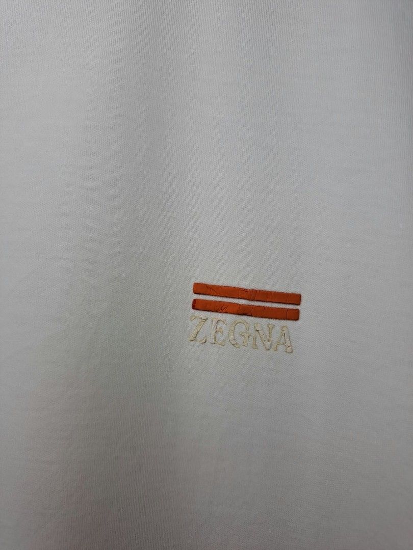 Zegna Basic White (Category: Luxury Apparel) located in Quezon City. Submitted by yaseen73 (Listing ID 1463797212, Image 3). Description: Zegna Rubberized Logo Cotton Fabric Stretchy Wearing Siz: XXL on Tag Dimensions : Please Refer to the Photo Color Rate : 9.5/10 - With Pinhole Issue - Minimal Cracks on Logo - Condition : 4.5/5 Off / Legit 450.00 Shipped Via J&T Around Metro Manila MOP : G C A S H B A N K T R A N S F E R Seller's Location : 📍B