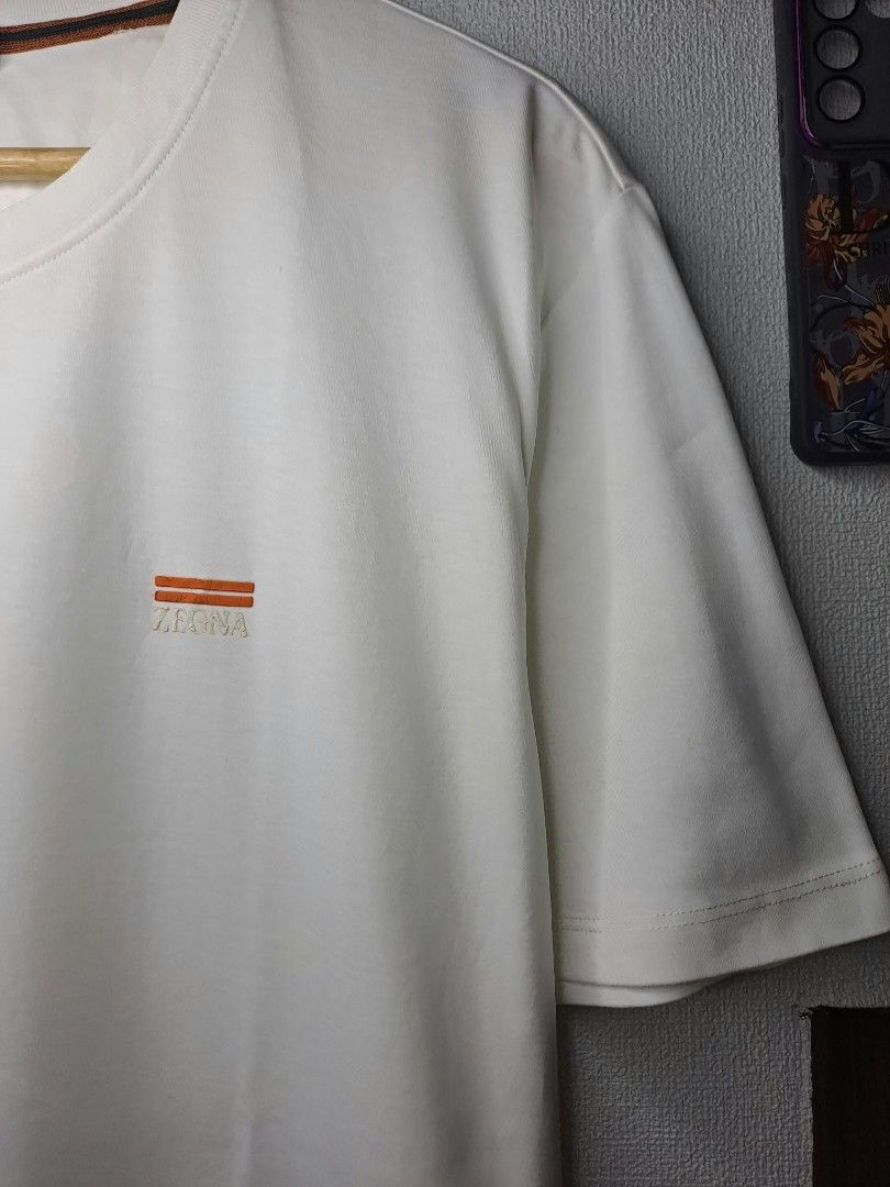 Zegna Basic White (Category: Luxury Apparel) located in Quezon City. Submitted by yaseen73 (Listing ID 1463797212, Image 2). Description: Zegna Rubberized Logo Cotton Fabric Stretchy Wearing Siz: XXL on Tag Dimensions : Please Refer to the Photo Color Rate : 9.5/10 - With Pinhole Issue - Minimal Cracks on Logo - Condition : 4.5/5 Off / Legit 450.00 Shipped Via J&T Around Metro Manila MOP : G C A S H B A N K T R A N S F E R Seller's Location : 📍B