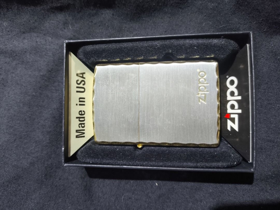Zippo Lighter with Fluid and Flints - Made in USA (Category: Vintage Collectibles) located in Manila. Submitted by weyvern28 (Listing ID 1463840040, Image 1). Description: - Brand new Zippo lighter, Gold plated. never used. - Comes in its original Zippo box. - Includes a can of premium lighter fluid. - Includes a pack of replacement flints. - Features a classic brushed metal finish. - Textured edges for a secure grip. - Authentic Zippo, Made in t