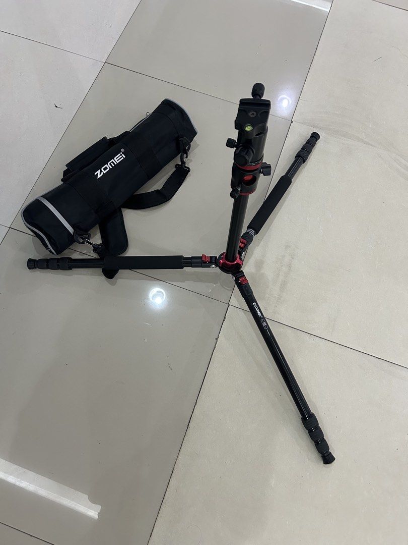 Zomei M8 Tripod with Bag (Category: Tripods & Monopods) located in Quezon City. Submitted by thriftxgoods (Listing ID 1463762646, Image 2). Description: - Zomei M8 Tripod - Ball head with quick release plate and bubble level - Adjustable legs for versatile positioning - Includes a durable carrying bag with a shoulder strap - Ideal for all your photography needs.