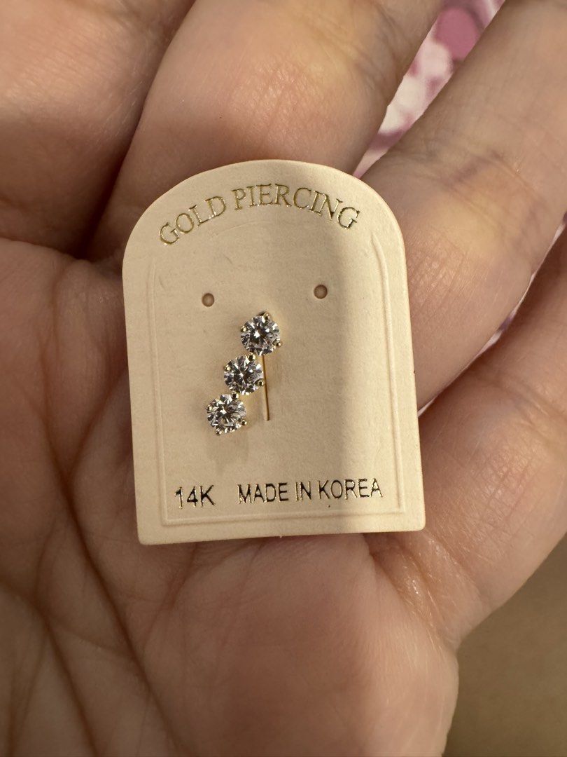 14K Gold Piercing Earrings (Category: Earrings) located in San Mateo. Submitted by donnalewisss (Listing ID 1464050070, Image 2). Description: - 1pc per design -Two pairs of 14K gold piercing earrings - Made in Korea - Style 1: Three small stones in a line - Style 2: Three stones stacked vertically - Ideal for ear cartilage - Adds a touch of sparkle -sold per piece -screw lock.