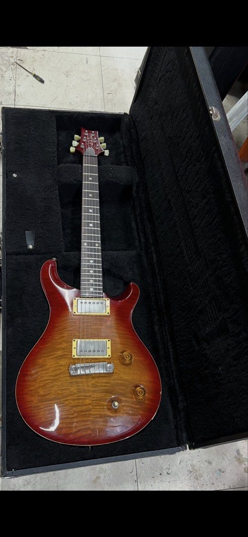 FS: 2002 PRS McCarty 10-top (Category: Musical Instruments) located in Paranaque City. Submitted by onecube7.onecube7 (Listing ID 1463944228, Image 2). Description: Rare moon inlay version. Flame / semi quilted 10 top w/ orig hardcase. Delivery c/o buyer or Ortigas meetup..
