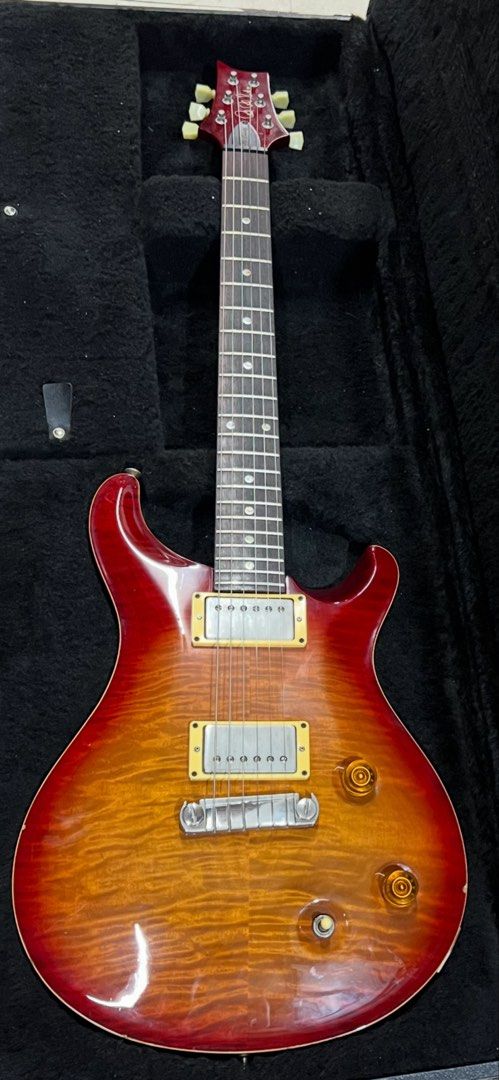 FS: 2002 PRS McCarty 10-top (Category: Musical Instruments) located in Paranaque City. Submitted by onecube7.onecube7 (Listing ID 1463944228, Image 1). Description: Rare moon inlay version. Flame / semi quilted 10 top w/ orig hardcase. Delivery c/o buyer or Ortigas meetup..