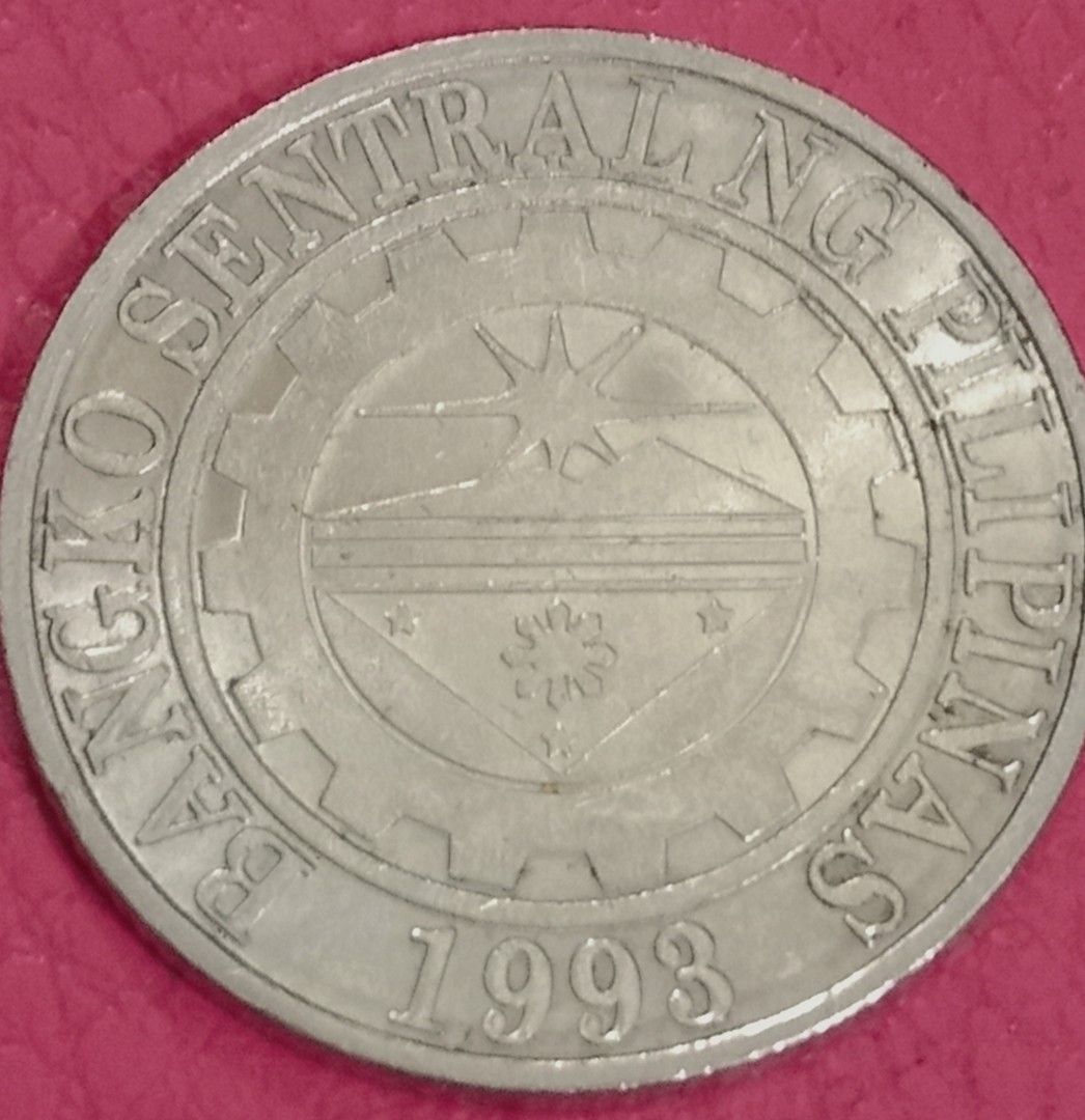 2015 1 piso reverse frosted (Category: Currency) located in Manila. Submitted by bbonggeez14 (Listing ID 1464097634, Image 2). Description: - Authentic Philippine 1 Peso coins - Features Jose Rizal on one side - Bangko Sentral ng Pilipinas logo on the other - Includes one coin dated 2015 - Includes one coin dated 1993 - Ideal for coin collectors - Great as a unique souvenir - Add this piece of Philippine history to your collection.