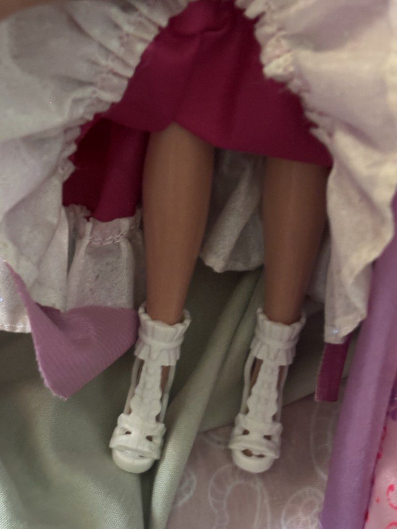 2 Barbie Dolls Princess Dresses (Category: Kids Toys) located in La Trinidad. Submitted by caicai1926 (Listing ID 1464013927, Image 3). Description: - Two beautiful Barbie princess dolls - Both have blonde hair and blue eyes - Doll 1: Pink princess gown with bow detail - Doll 2: Purple and pink satin gown with gold trim and rose accent - Includes matching shoes for both dolls.