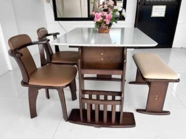 4-Seater Foldable Dining Set (Category: Tables & Sets) located in Mexico. Submitted by mgracejapansurplus (Listing ID 1464043945, Image 2). Description: NEW ARRIVAL 🔥 JAPAN SURPLUS 🇯🇵 ▪️4-Seater Foldable Dining Set ✨ - White smooth top table with dark solid wood frame . - Side drop-leaf / foldable design — space-saving & versatile - 2 swivel chairs with brown padded seats + 1 cream-upholstered bench - Sturdy pedestal base, classic functional s