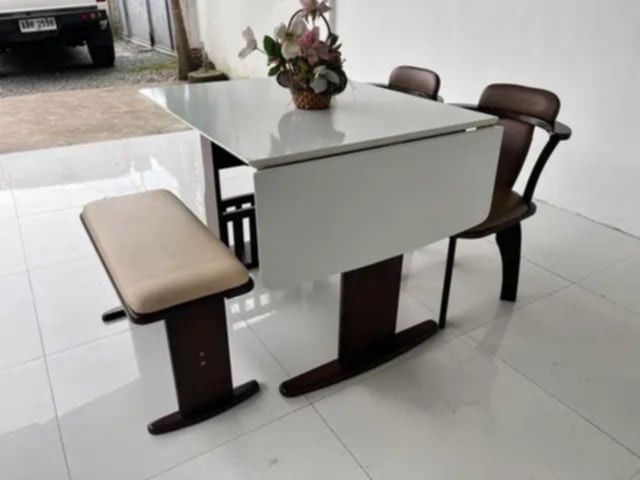4-Seater Foldable Dining Set (Category: Tables & Sets) located in Mexico. Submitted by mgracejapansurplus (Listing ID 1464043945, Image 3). Description: NEW ARRIVAL 🔥 JAPAN SURPLUS 🇯🇵 ▪️4-Seater Foldable Dining Set ✨ - White smooth top table with dark solid wood frame . - Side drop-leaf / foldable design — space-saving & versatile - 2 swivel chairs with brown padded seats + 1 cream-upholstered bench - Sturdy pedestal base, classic functional s