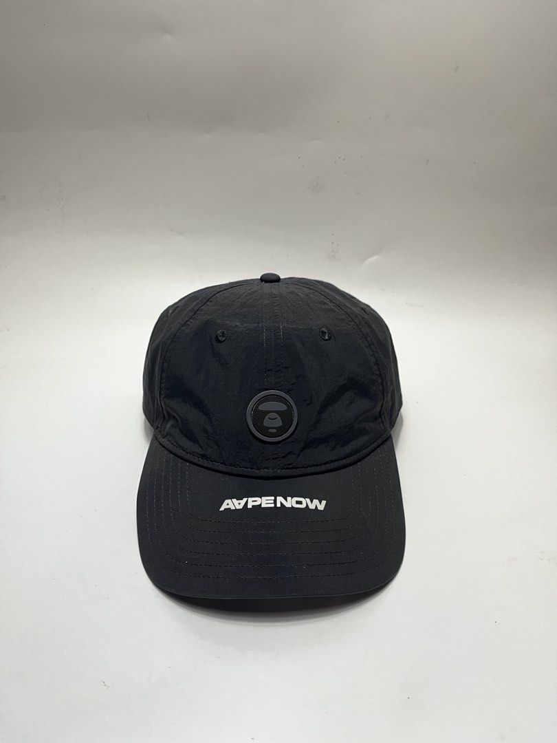 A BATHING APE APE NOW Black Baseball Cap (Category: Caps & Hats) located in Iloilo. Submitted by fromthebins.ilo2 (Listing ID 1464052199, Image 1). Description: - Authentic Black APE NOW cap - Features iconic APE logo on the front - "Somewhere in The AAPE Universe" text embroidered on the back - Adjustable strap for a custom fit - Includes original tags and authenticity sticker -Details posted Mop:gcash / Bank transfer Courier:J&T / Lbc ❗️FREE SH