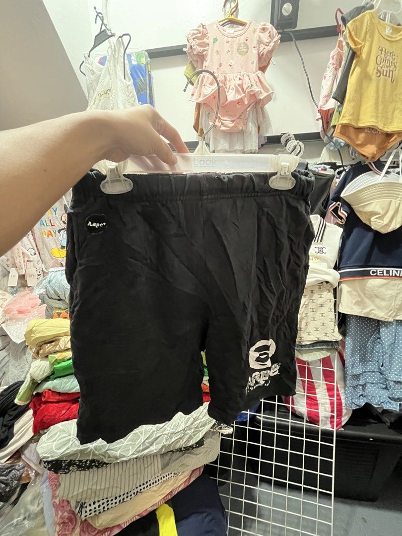 A Bathing Ape BAPE Black Shorts Size M (Category: Shorts) located in Quezon City. Submitted by casabalerica (Listing ID 1463943084, Image 1). Description: -See damage - Brand: Aape - Color: Black - Size: Medium (M) - Features: Elastic waistband, iconic BAPE logo on leg, small back pocket with text - Style: Great for casual wear.
