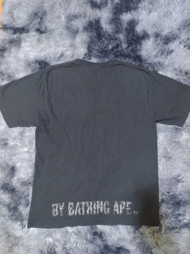 A Bathing Ape BAPE Camo Ape Head Tee Black (Category: Tshirts & Polo Shirts ) located in Rizal. Submitted by keepthrift15 (Listing ID 1464054759, Image 2). Description: Bape Black Camo Ape Face Authentic Size small on tag, 19x27 No issue Excellent condition (9.5/10) ₱1,400 (negotiable) Color may vary due to lighting .