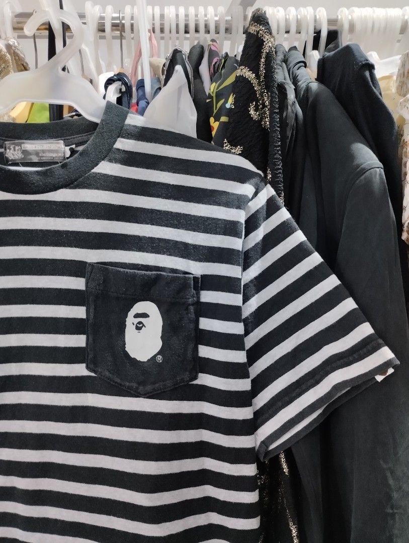 A Bathing Ape BAPE Striped Pocket Tee (Category: Tshirts & Polo Shirts ) located in Manila. Submitted by niggzreyno51476 (Listing ID 1464033034, Image 2). Description: - Classic BAPE tee with horizontal stripes - Iconic ape head logo on chest pocket - Size: Medium (M) - Ideal for everyday casual wear - Don't miss out on this stylish piece!.