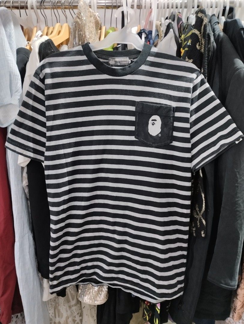 A Bathing Ape BAPE Striped Pocket Tee (Category: Tshirts & Polo Shirts ) located in Manila. Submitted by niggzreyno51476 (Listing ID 1464033034, Image 1). Description: - Classic BAPE tee with horizontal stripes - Iconic ape head logo on chest pocket - Size: Medium (M) - Ideal for everyday casual wear - Don't miss out on this stylish piece!.