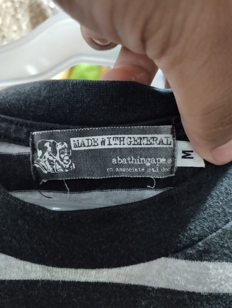 A Bathing Ape BAPE Striped Pocket Tee (Category: Tshirts & Polo Shirts ) located in Manila. Submitted by niggzreyno51476 (Listing ID 1464033034, Image 3). Description: - Classic BAPE tee with horizontal stripes - Iconic ape head logo on chest pocket - Size: Medium (M) - Ideal for everyday casual wear - Don't miss out on this stylish piece!.