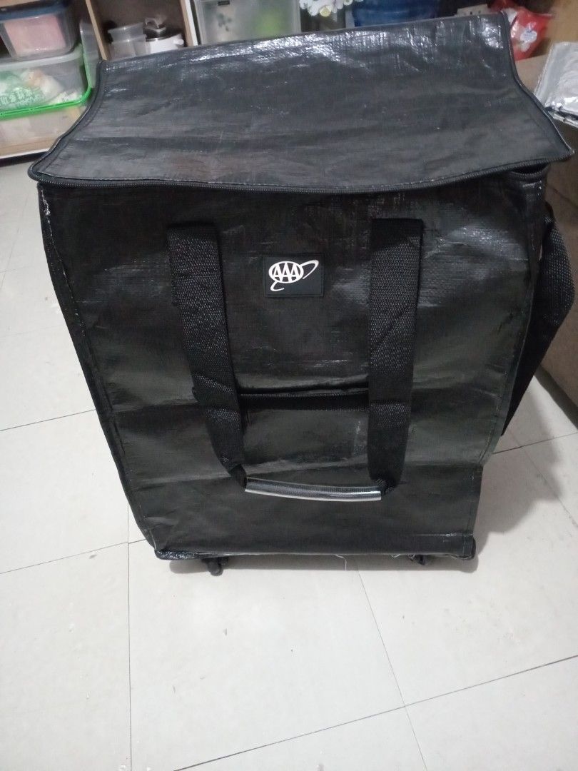 AAA Rolling Luggage Bag with Wheels (Category: Looking For) located in Marikina City. Submitted by joyful.finds (Listing ID 1463980886, Image 1). Description: - Black rolling luggage bag - Two sturdy handles and a retractable pull handle - Five wheels for easy maneuverability - Features the AAA logo on the front - Ample interior space for travel or storage.