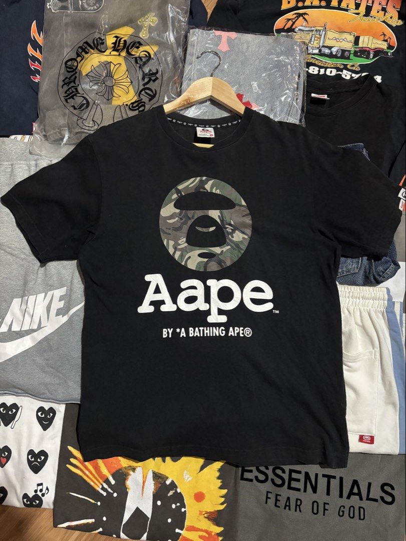 AAPE BATHING APE CAMO MOON FACE (Category: Tshirts & Polo Shirts ) located in San Jose. Submitted by jerown (Listing ID 1460223841, Image 1). Description: •L28 x W21 •EXCELLENT CONDITION •COLOR RATE 9.5/10 or better •ALL DETAILS ARE POSTED •NO ISSUE.