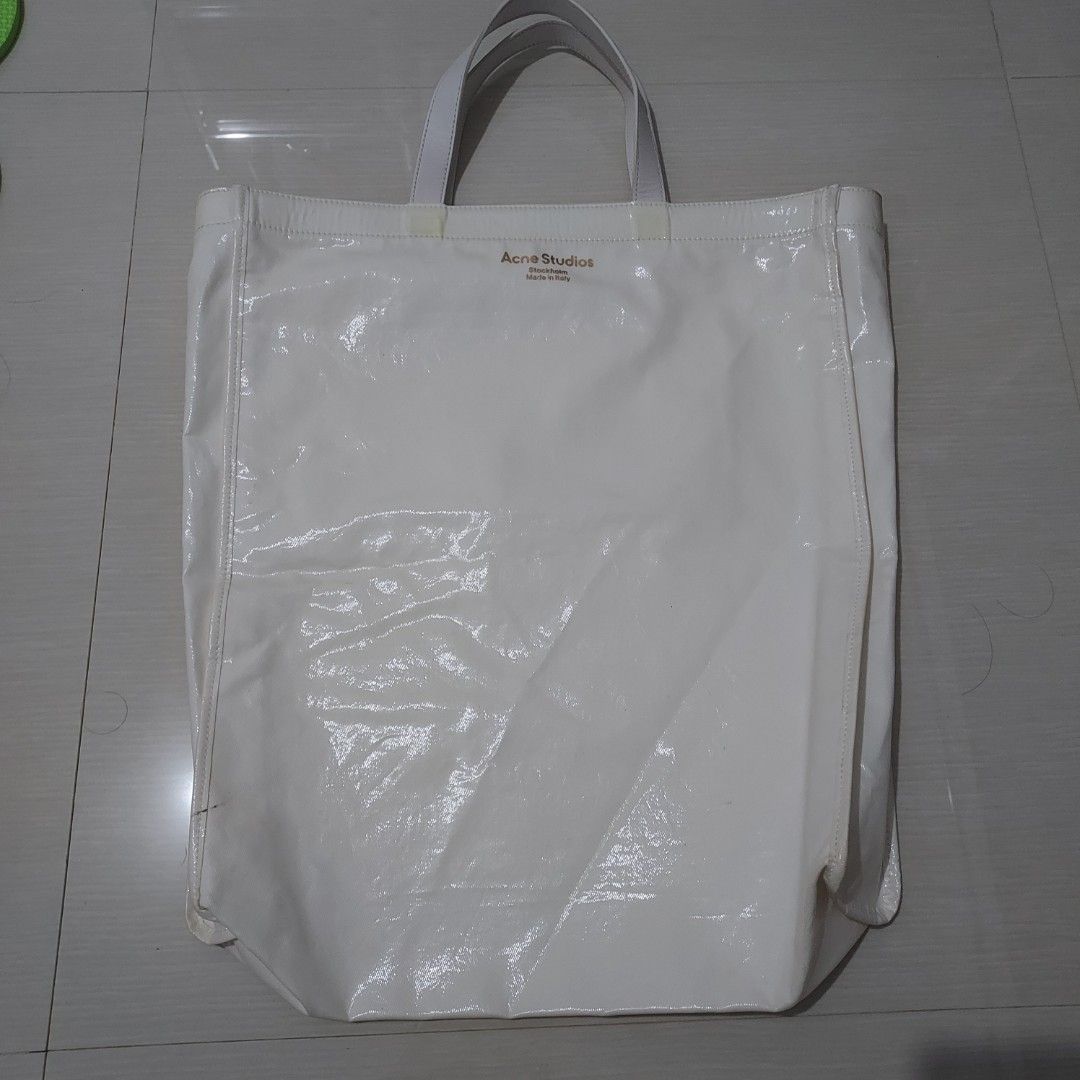 Acne totebag (Category: Tote Bags) located in Puerto Princesa. Submitted by helwapalawan (Listing ID 1463950257, Image 1). Description: Acne studios white with leather inner issue with yellow wish part only authntc 1000 freeship.