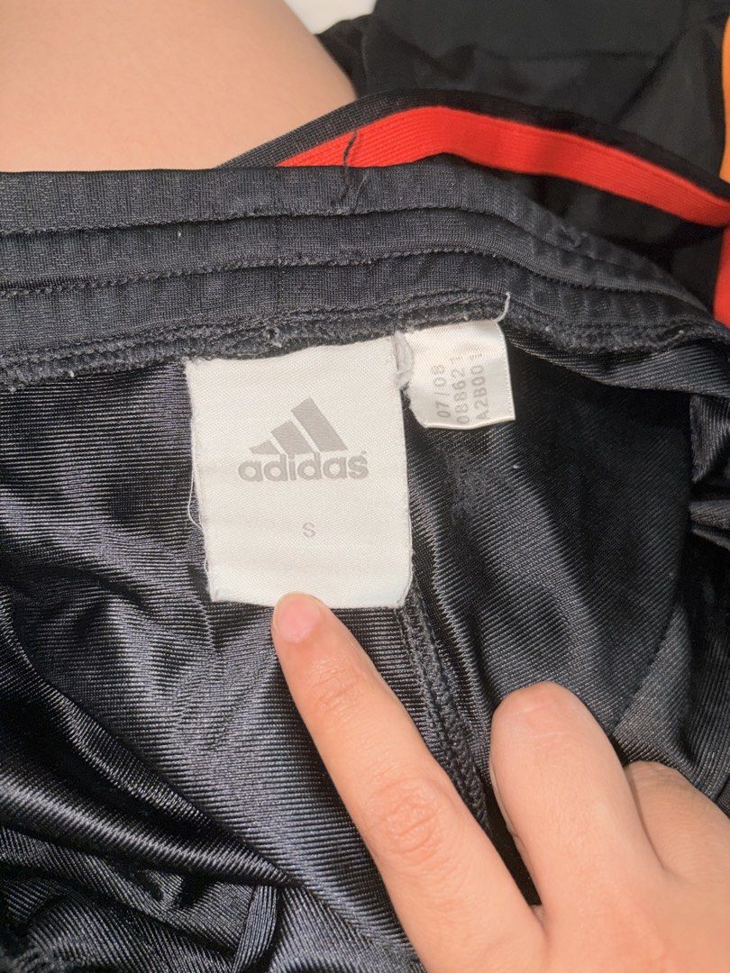 Adidas Black Orange Track Pants Size S (Category: Activewear) located in Dasmarinas. Submitted by thriftcavite (Listing ID 1463941608, Image 2). Description: Issue: medyo maluwag na yung garter sa waist .