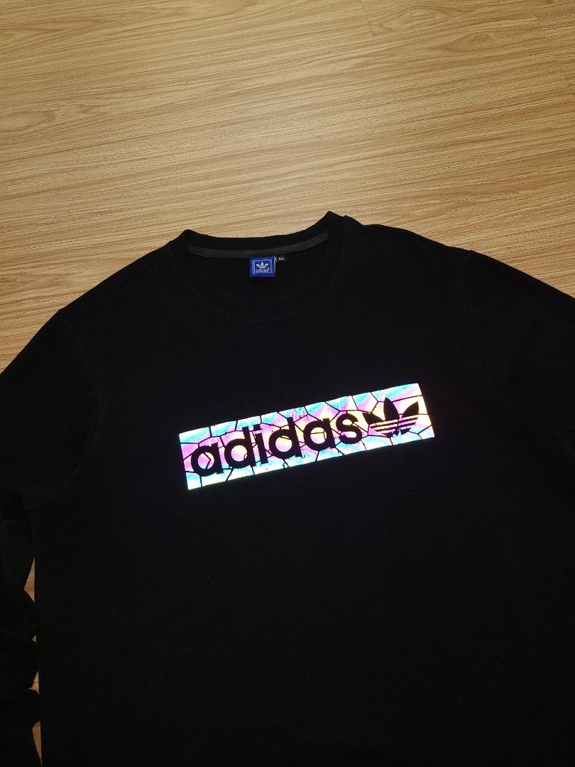 Adidas Black Sweatshirt with Reflective Logo (Category: Coats, Jackets and Outerwear) located in Quezon City. Submitted by mofinds.ph (Listing ID 1464003891, Image 3). Description: Size: 4XL on tag Dimes: 22x28 Condition: Excellent/Great condition MOP: BPI DELIVER: LALAMOVE OR J&T MEETUP/PICKUP: Victoria Tower D, Mother Ignacia Ave., Brgy. Paligsahan, Diliman, Quezon City.