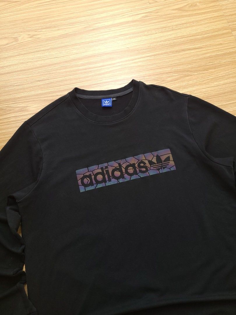 Adidas Black Sweatshirt with Reflective Logo (Category: Coats, Jackets and Outerwear) located in Quezon City. Submitted by mofinds.ph (Listing ID 1464003891, Image 2). Description: Size: 4XL on tag Dimes: 22x28 Condition: Excellent/Great condition MOP: BPI DELIVER: LALAMOVE OR J&T MEETUP/PICKUP: Victoria Tower D, Mother Ignacia Ave., Brgy. Paligsahan, Diliman, Quezon City.