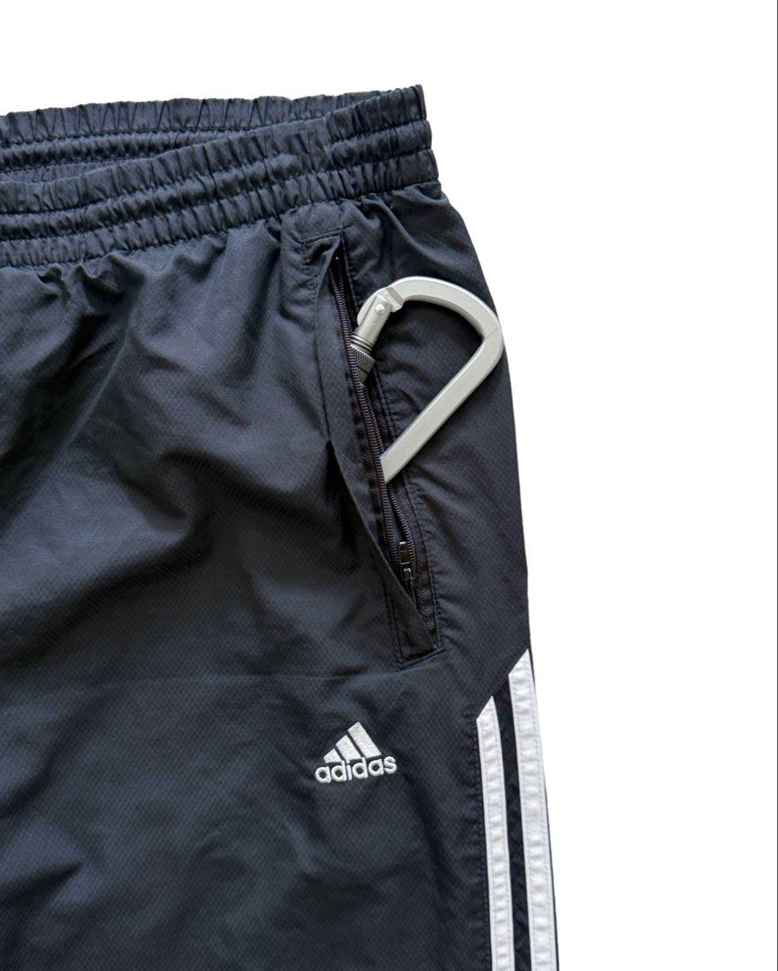 Adidas Black Track Pants (Category: Joggers) located in Manila. Submitted by morf_sply (Listing ID 1464001730, Image 2). Description: Loose fit classic sport tracksuit bottoms with inner layering and technical utility fabric for intense workout. Bold stripes sideways with a drawcord closure for an adjustable fit. Heel bite. M on tag Waist 32-34 in Rise 11 in Inseam 28 in Length 39 in Leg Opening 9 in .