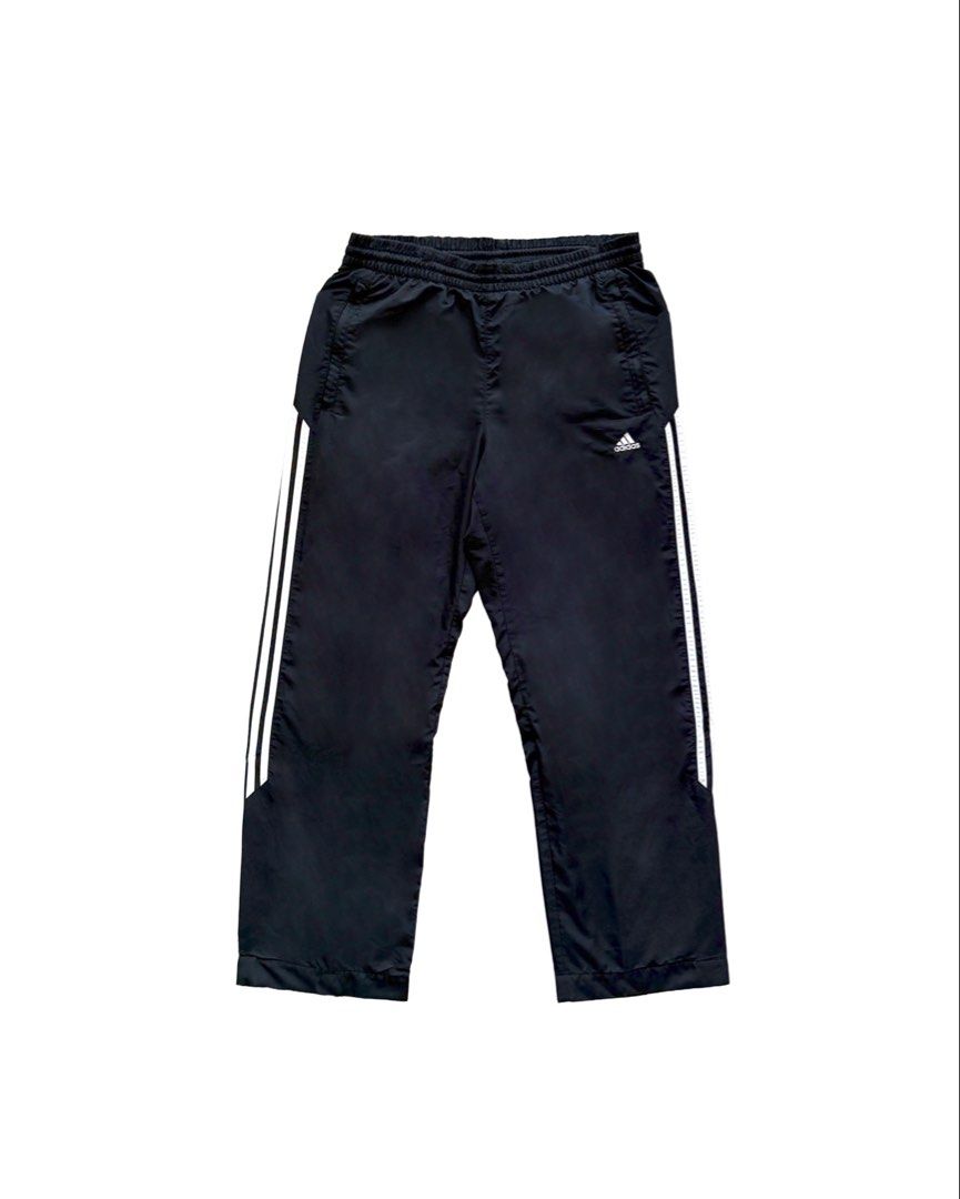 Adidas Black Track Pants (Category: Joggers) located in Manila. Submitted by morf_sply (Listing ID 1464001730, Image 1). Description: Loose fit classic sport tracksuit bottoms with inner layering and technical utility fabric for intense workout. Bold stripes sideways with a drawcord closure for an adjustable fit. Heel bite. M on tag Waist 32-34 in Rise 11 in Inseam 28 in Length 39 in Leg Opening 9 in .