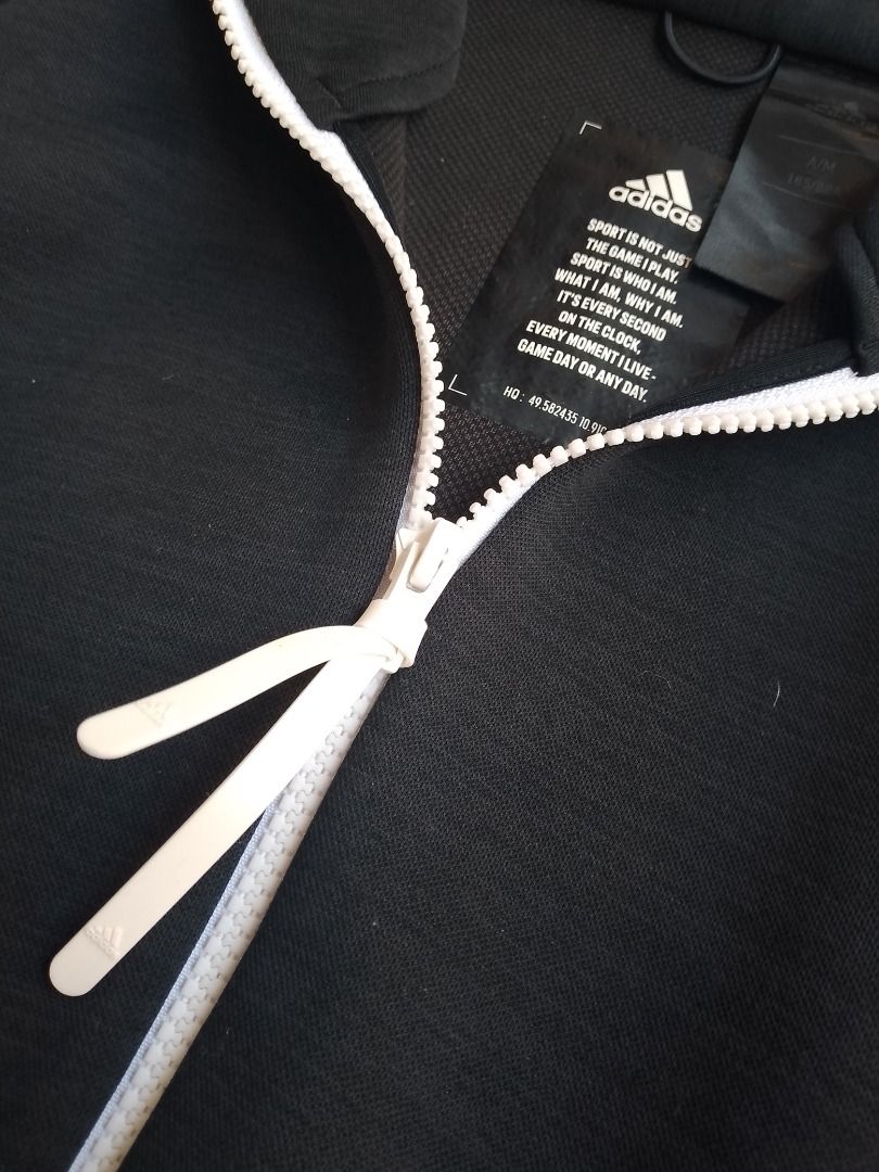 Adidas Black Zip-Up Hoodie (Category: Hoodies) located in Caloocan City. Submitted by hoodiegeng (Listing ID 1464047723, Image 3). Description: - Black Adidas hoodie - Full zip closure - Two front pockets - White accents - Adidas logo on sleeve and chest - Comfortable and stylish - Ideal for workouts or casual wear.