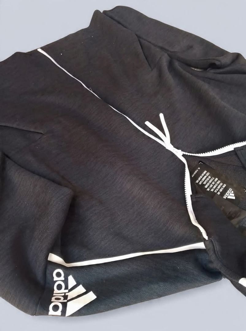 Adidas Black Zip-Up Hoodie (Category: Hoodies) located in Caloocan City. Submitted by hoodiegeng (Listing ID 1464047723, Image 2). Description: - Black Adidas hoodie - Full zip closure - Two front pockets - White accents - Adidas logo on sleeve and chest - Comfortable and stylish - Ideal for workouts or casual wear.