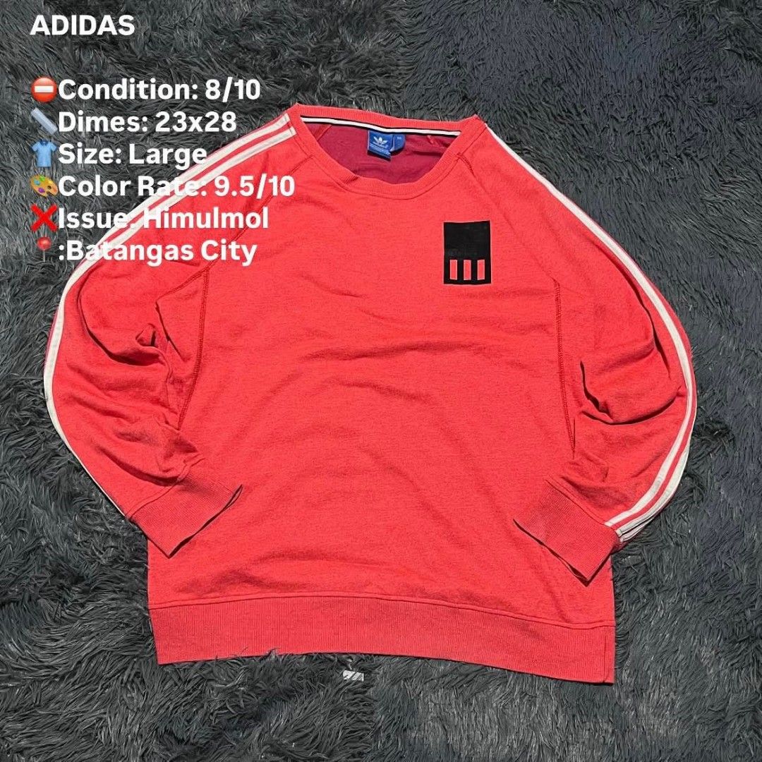 Adidas Crewneck Sweatshirt - Large - Red (Category: Coats, Jackets and Outerwear) located in Batangas. Submitted by jaylord_g (Listing ID 1464111428, Image 1). Description: - Red Adidas Crewneck Sweatshirt - Size: Large - Features: Classic three stripes on sleeves, black logo patch on chest - Measurements: 23" (width) x 28" (length) - Location: Batangas City.
