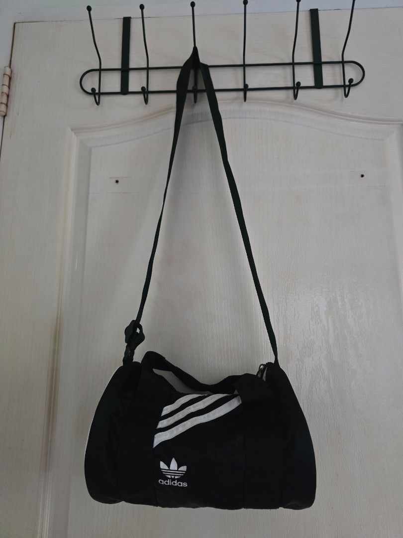 Adidas nylon mini duffle bag (Category: Cross-body Bags) located in Cavite. Submitted by rydes_clo (Listing ID 1464047905, Image 1). Description: 🤎original 🤎 cute 🤎bagay kahit saan 🤎nylon material bagay sa weather natin ngayon 🤎maraming mailalagay sa loob 🤎kasya payong ko sa loob rfs: decluttering.