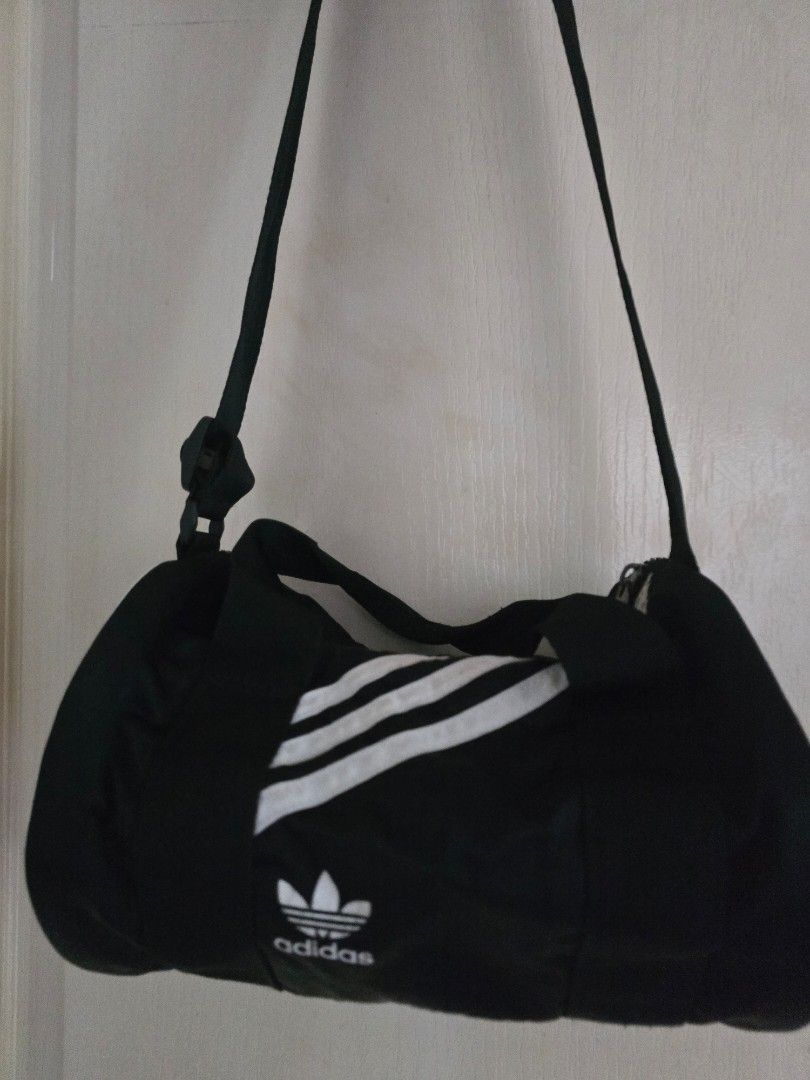 Adidas nylon mini duffle bag (Category: Cross-body Bags) located in Cavite. Submitted by rydes_clo (Listing ID 1464047905, Image 2). Description: 🤎original 🤎 cute 🤎bagay kahit saan 🤎nylon material bagay sa weather natin ngayon 🤎maraming mailalagay sa loob 🤎kasya payong ko sa loob rfs: decluttering.