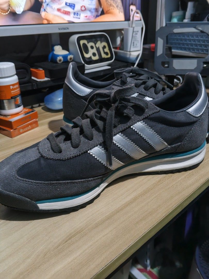 Adidas SL 72 Grey Silver Teal Sneakers (Category: Sneakers & Footwear) located in Manila. Submitted by odri.pujante (Listing ID 1463939512, Image 3). Description: - Original Adidas Shoes - Adidas SL 72 sneakers - Color: Dark grey with silver stripes and teal accents - Style: Classic running shoe - Laces: Grey - Soles: White and teal - Perfect for casual wear - Please check photos for detailed condition Meetup: Jollibee Bayanan, Main Square, SM Ba