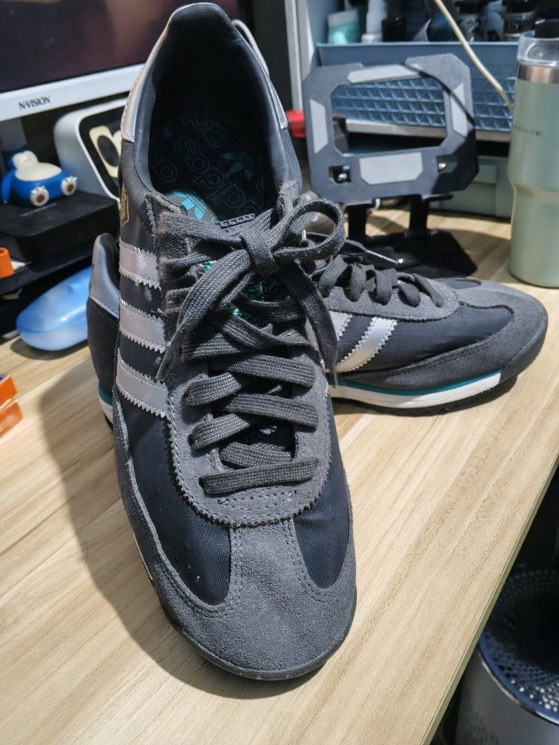 Adidas SL 72 Grey Silver Teal Sneakers (Category: Sneakers & Footwear) located in Manila. Submitted by odri.pujante (Listing ID 1463939512, Image 2). Description: - Original Adidas Shoes - Adidas SL 72 sneakers - Color: Dark grey with silver stripes and teal accents - Style: Classic running shoe - Laces: Grey - Soles: White and teal - Perfect for casual wear - Please check photos for detailed condition Meetup: Jollibee Bayanan, Main Square, SM Ba