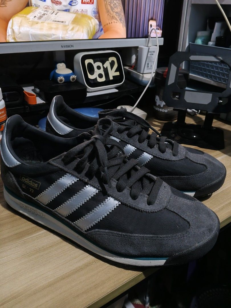 Adidas SL 72 Grey Silver Teal Sneakers (Category: Sneakers & Footwear) located in Manila. Submitted by odri.pujante (Listing ID 1463939512, Image 1). Description: - Original Adidas Shoes - Adidas SL 72 sneakers - Color: Dark grey with silver stripes and teal accents - Style: Classic running shoe - Laces: Grey - Soles: White and teal - Perfect for casual wear - Please check photos for detailed condition Meetup: Jollibee Bayanan, Main Square, SM Ba
