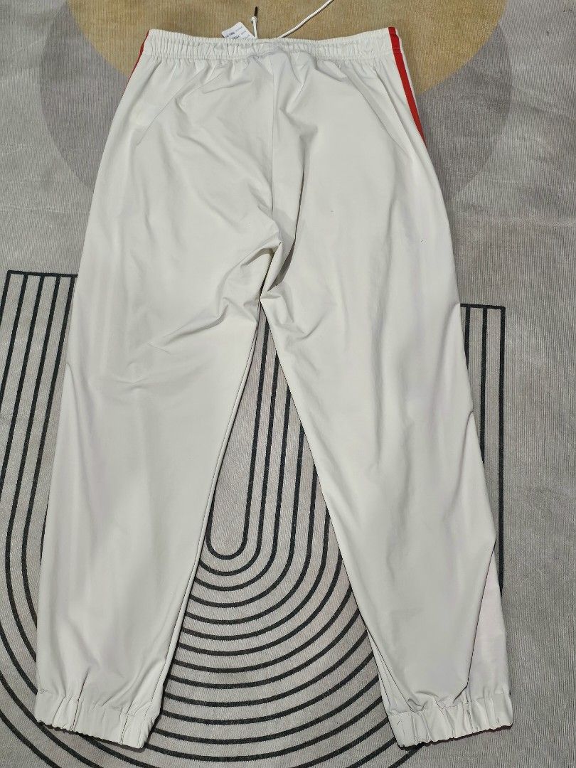 Adidas White Red Joggers (Category: Joggers) located in Baguio. Submitted by kayeonlineshop (Listing ID 1464027906, Image 2). Description: adidas MDN Track Pant in white, featuring bold red side stripes and zippered front pockets w 34 max l36.