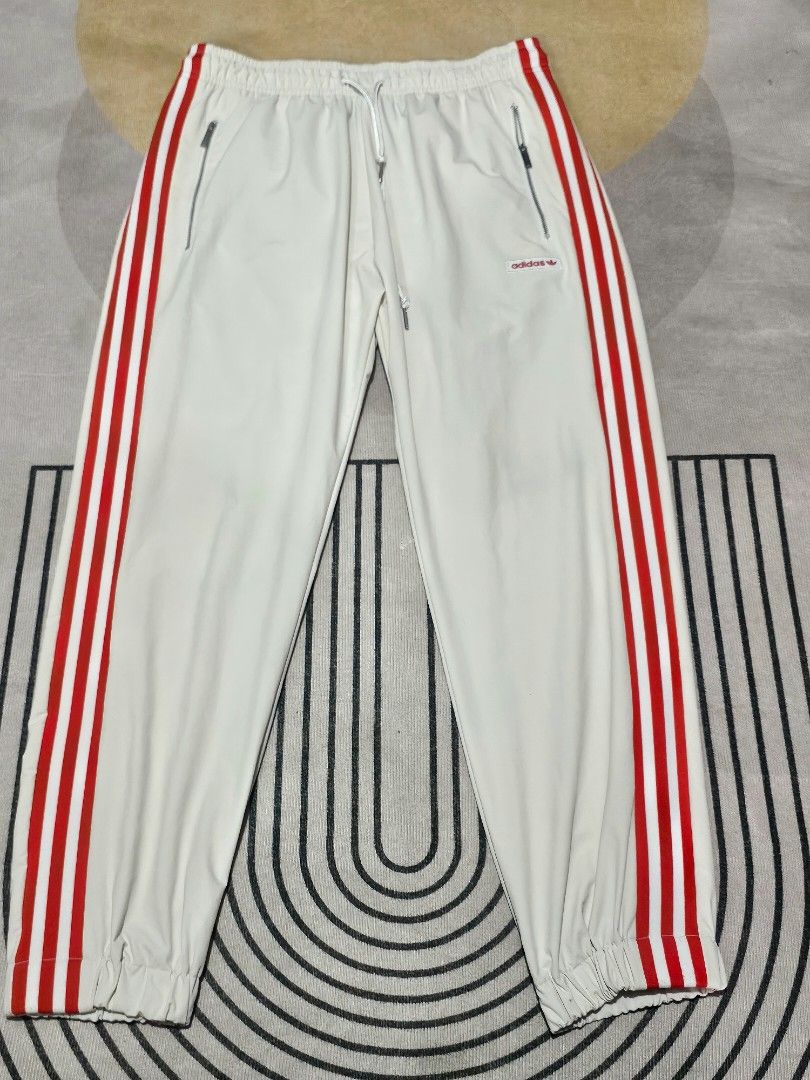 Adidas White Red Joggers (Category: Joggers) located in Baguio. Submitted by kayeonlineshop (Listing ID 1464027906, Image 1). Description: adidas MDN Track Pant in white, featuring bold red side stripes and zippered front pockets w 34 max l36.
