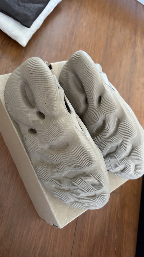 Adidas Yeezy Foam Runner Slides (Category: Slippers & Slides) located in Taguig. Submitted by mavycat.0208 (Listing ID 1463960779, Image 3). Description: - Authentic Adidas Yeezy Foam Runners - Unique, modern clog-like design with distinctive cutouts - Extremely comfortable for all-day wear - Stylish and versatile for any outfit - Includes original box - Highly sought-after and popular slides - needs cleaning.