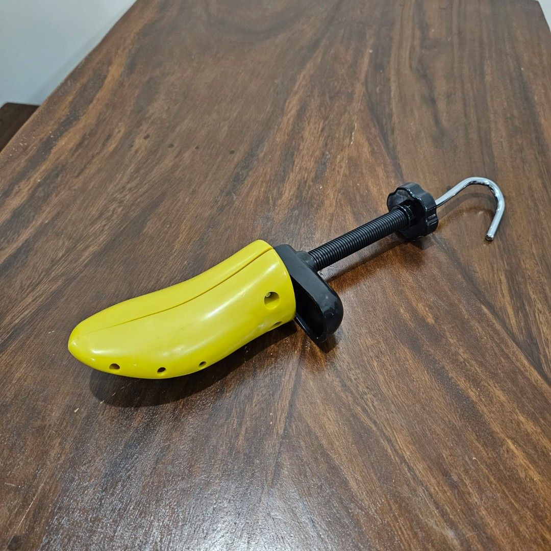 Adjustable Shoe Stretcher / Shaper Tool (Category: Shoe inserts & accessories) located in Quezon City. Submitted by reply_1982 (Listing ID 1463971390, Image 1). Description: - Yellow adjustable shoe stretcher - Stretches tight shoes for a more comfortable fit - Features a metal hook for easy insertion and removal - Suitable for both shoes and boots.