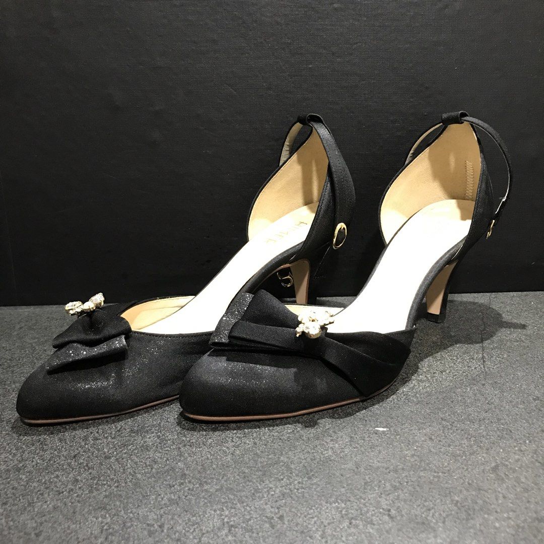 AIMER Black Glitter Bow Heels with Ankle Strap (Category: Heels) located in Baao. Submitted by all.things.japan (Listing ID 1463990646, Image 2). Description: - Black glitter heels from AIMER - Adorable bow with rhinestones on the front - Adjustable ankle strap for a secure fit - Moderate heel height - Ideal for dressing up your look.