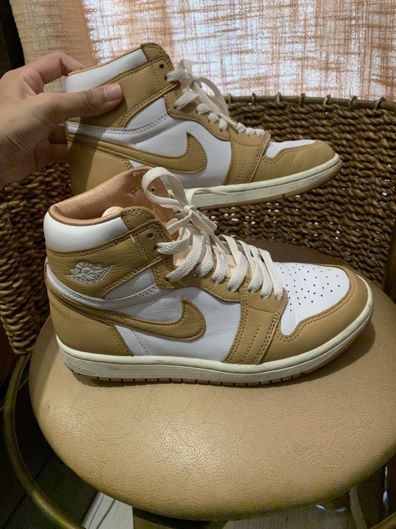 Air Jordan 1 High OG Praline (Category: Sneakers) located in Paranaque City. Submitted by zyyee (Listing ID 1463943309, Image 2). Description: - Air Jordan 1 High OG - Colorway: Praline and White - Classic high-top silhouette - Premium leather upper - Perforated toe box for breathability - Iconic Air Jordan Wings logo on the ankle - Cream-colored laces with extra satin laces and box -Just needs cleaning, excellent condition - Perfect addition to 