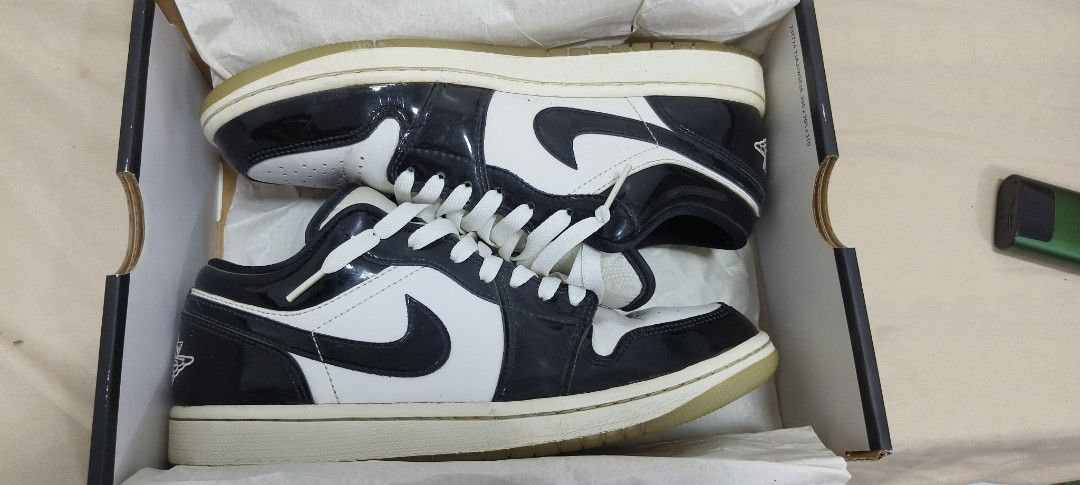 Air Jordan 1 Low Concord (Category: Sneakers) located in Anda. Submitted by Pollit0_77 (Listing ID 1464072500, Image 1). Description: - Brand: Air Jordan - Model: 1 Low SE - Color: Black & White Patent Leather - Size: 7.5 US Men's - Condition: Comes with original box - Ideal for: Casual wear or collecting.